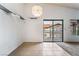 Dining area features tile flooring and a sliding glass door to a balcony at 1575 W Warm Springs Rd # 121, Henderson, NV 89014