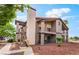 Condo exterior showing stairs leading to upper units with private balconies at 1575 W Warm Springs Rd # 121, Henderson, NV 89014