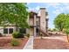 Traditional two-story condo with well-maintained landscaping at 1575 W Warm Springs Rd # 121, Henderson, NV 89014