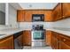 Well-equipped kitchen with stainless steel oven, dishwasher, and ample counter space at 1575 W Warm Springs Rd # 121, Henderson, NV 89014