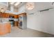 Functional kitchen with stainless steel appliances, tile floors, and wood cabinets at 1575 W Warm Springs Rd # 121, Henderson, NV 89014