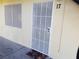 Tan exterior with a decorative security screen door and floral welcome mat at 212 Orland St # 17, Las Vegas, NV 89107