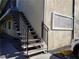 Exterior stairway with black metal railing, leading to upper-level apartments at 212 Orland St # 17, Las Vegas, NV 89107