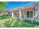 A backyard featuring a grassy area and a covered patio at 2137 Point Mallard Dr, Henderson, NV 89012