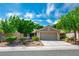 Charming single-story home features a well-manicured lawn, desert landscaping, and an attached two-car garage at 2137 Point Mallard Dr, Henderson, NV 89012