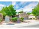 Attractive home with lush landscaping, a two-car garage, and a community mailbox for convenient mail delivery at 2137 Point Mallard Dr, Henderson, NV 89012