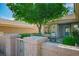 Inviting front patio with cozy seating, framed by a charming wall and lush landscaping for relaxing outdoor living at 2137 Point Mallard Dr, Henderson, NV 89012