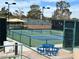 Outdoor pickleball courts with blue and green surfaces, surrounded by fencing at 2137 Point Mallard Dr, Henderson, NV 89012