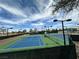 Multiple blue and green tennis courts on a sunny day are ready for a match at 2137 Point Mallard Dr, Henderson, NV 89012