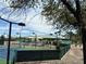 View of a tennis court next to a building at 2137 Point Mallard Dr, Henderson, NV 89012
