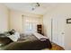 Bedroom with wood floor, a window with shutters and a closet at 2213 Carrier Dove Way, North Las Vegas, NV 89084