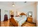 This cozy bedroom offers a view of the bathroom and a queen-sized bed at 2213 Carrier Dove Way, North Las Vegas, NV 89084
