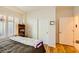 Bedroom with wood floor, a window with shutters and a closet at 2213 Carrier Dove Way, North Las Vegas, NV 89084