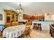 Charming dining area adjacent to the kitchen, featuring a floral-covered table and wood furniture at 2213 Carrier Dove Way, North Las Vegas, NV 89084