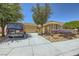 Delightful single-story residence showing a water-wise yard, a neutral façade, and an attached two-car garage at 2213 Carrier Dove Way, North Las Vegas, NV 89084
