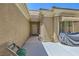 Warm single-story home presenting desert landscaping, a neutral exterior, and an attached two-car garage at 2213 Carrier Dove Way, North Las Vegas, NV 89084
