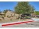 Beautiful single-story house displaying a low-water garden, a neutral exterior finish, and an attached two-car garage at 2213 Carrier Dove Way, North Las Vegas, NV 89084