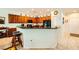Spacious kitchen with granite countertops, black appliances, and a convenient breakfast bar with seating at 2213 Carrier Dove Way, North Las Vegas, NV 89084
