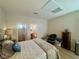 Cozy main bedroom featuring a large bed, ensuite, and a closet at 2213 Carrier Dove Way, North Las Vegas, NV 89084
