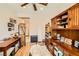A spacious home office is equipped with custom cabinets and ample workspace at 2213 Carrier Dove Way, North Las Vegas, NV 89084