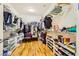 Spacious walk-in closet with shelving, rods, and organized storage at 2213 Carrier Dove Way, North Las Vegas, NV 89084