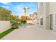 Private backyard with pool, palm trees, and lush foliage at 2236 Timber Rose Dr, Las Vegas, NV 89134