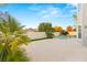 Lush backyard with sparkling pool, mature landscaping, and privacy wall at 2236 Timber Rose Dr, Las Vegas, NV 89134