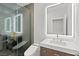 Modern bathroom featuring glass shower, marbled tile, and modern sink with gold hardware at 2236 Timber Rose Dr, Las Vegas, NV 89134
