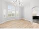 Bedroom features wood floors, bay windows with decorative shutters, and contemporary lighting at 2236 Timber Rose Dr, Las Vegas, NV 89134