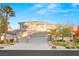 Beautiful two-story home with a three-car garage and mature landscaping at 2236 Timber Rose Dr, Las Vegas, NV 89134
