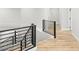 Second story hallway featuring light wood flooring and metal handrails at 2236 Timber Rose Dr, Las Vegas, NV 89134
