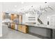 Modern kitchen features a large island with countertop, stainless steel appliances, and stylish lighting at 2236 Timber Rose Dr, Las Vegas, NV 89134