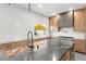 Modern kitchen with stainless steel appliances, large island, and sleek countertops and bright wooden cabinets at 2236 Timber Rose Dr, Las Vegas, NV 89134