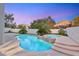 Inviting backyard pool and spa with lush tropical landscaping at 2236 Timber Rose Dr, Las Vegas, NV 89134