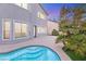 Backyard pool with tropical landscaping at 2236 Timber Rose Dr, Las Vegas, NV 89134