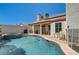 Inviting backyard pool and spa with a covered patio, perfect for outdoor relaxation and entertaining at 2301 Jean Paul Ave, North Las Vegas, NV 89031