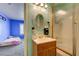 Bathroom featuring a framed mirror, decorative lights, vanity, and shower-tub with gold frame at 2301 Jean Paul Ave, North Las Vegas, NV 89031