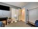 Bedroom features a TV, closet and desk area; a door leading to the washroom is visible at 2301 Jean Paul Ave, North Las Vegas, NV 89031