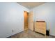 A cozy room with a dresser, soft carpet and a door leading to a room with ceramic flooring at 2301 Jean Paul Ave, North Las Vegas, NV 89031