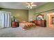 Green bedroom featuring carpet floors, dark wood furniture, and large closet at 2301 Jean Paul Ave, North Las Vegas, NV 89031