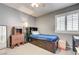 Bedroom featuring a bed, storage, a window with blinds, carpet flooring, and a ceiling fan at 2301 Jean Paul Ave, North Las Vegas, NV 89031