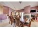Inviting dining area with wooden table, chairs, fireplace, and natural light at 2301 Jean Paul Ave, North Las Vegas, NV 89031