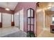 The hallway includes a double door, decorative lighting, tile flooring and gray area rug at 2301 Jean Paul Ave, North Las Vegas, NV 89031