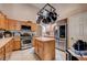 Kitchen featuring stainless steel appliances, wooden cabinets and a tile floor at 2301 Jean Paul Ave, North Las Vegas, NV 89031