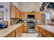 Kitchen featuring stainless steel appliances, light countertops and tile flooring at 2301 Jean Paul Ave, North Las Vegas, NV 89031