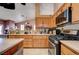 Kitchen featuring wooden cabinets and stainless steel appliances at 2301 Jean Paul Ave, North Las Vegas, NV 89031