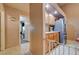 Kitchenette with wooden cabinets, stainless steel refrigerator, and tile flooring at 2301 Jean Paul Ave, North Las Vegas, NV 89031
