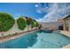 Sparkling in-ground pool and spa accented by mature landscaping, ideal for relaxing and entertaining at 2301 Jean Paul Ave, North Las Vegas, NV 89031