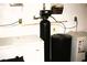 Functional storage room with a water softener system and extra freezers for ample cold storage at 2301 Jean Paul Ave, North Las Vegas, NV 89031