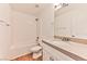 Bathroom featuring a tub, vanity, and tile backsplash with neutral color scheme at 2323 Mariposa Ave, Las Vegas, NV 89104